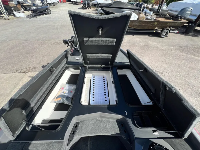 Slide: The Image of 2025 Skeeter ZXR 21 boat interior with open storage compartments and organized layout. - 5