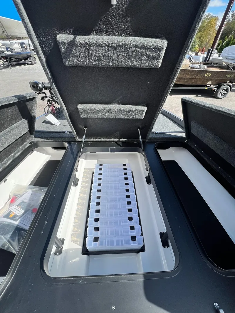 Slide: The Image of Open storage compartment of 2025 Skeeter ZXR 21 boat, showcasing interior design. - 6