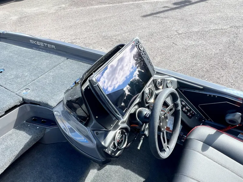 Slide: The Image of Skeeter ZXR 21 boat dashboard, 2025 model, featuring advanced controls and navigation display. - 7