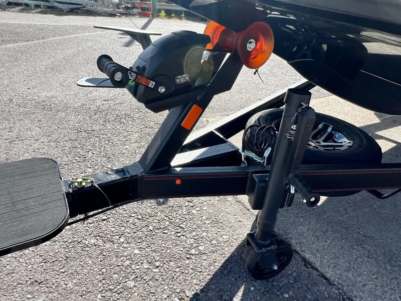 Slide: The Image of Close-up of 2025 Skeeter ZXR 21 boat trailer hitch and wheel assembly. - 9