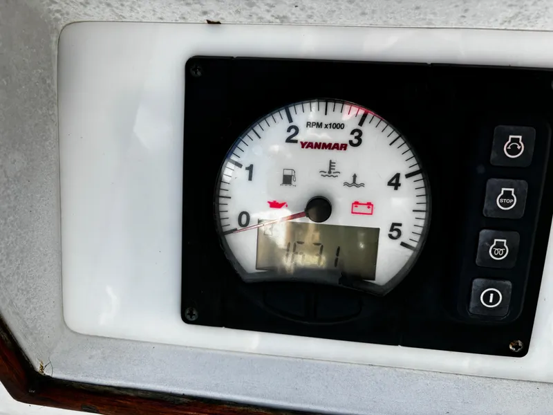 Slide: The Image of Yanmar RPM gauge on 1982 J Boats 30 sailboat dashboard. - 2