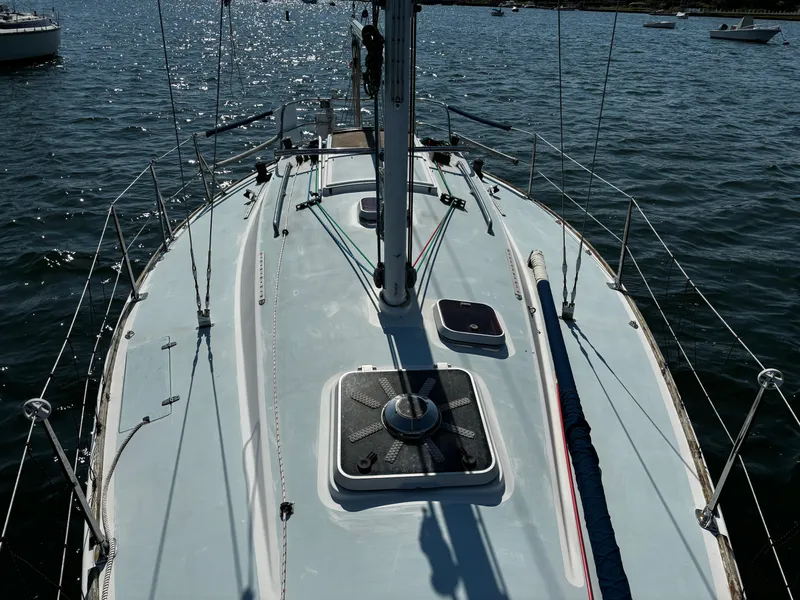Slide: The Image of 1982 J Boats J30 sailboat deck view on calm water. - 4