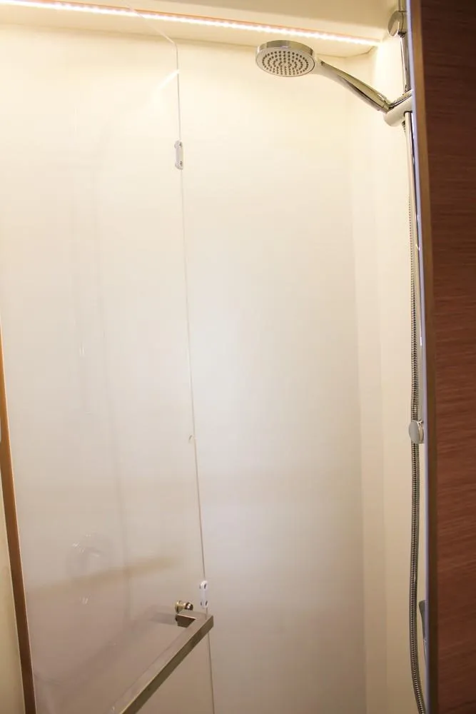 Slide: The Image of Modern shower in 2024 Jeanneau Sun Odyssey 490 yacht bathroom. - 25