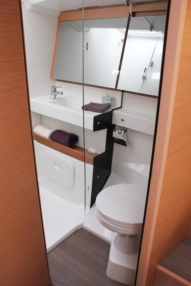 Slide: The Image of Modern bathroom in 2025 Jeanneau Sun Odyssey 440 yacht, featuring sleek design and amenities. - 9