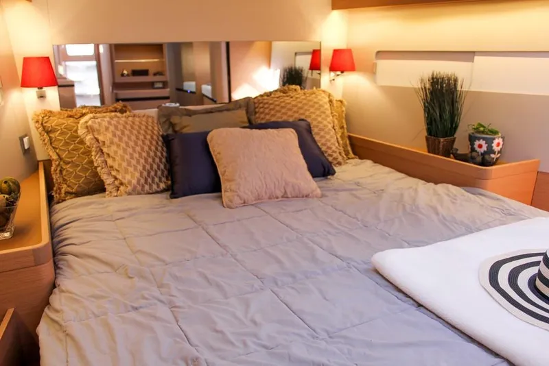 Slide: The Image of Luxurious bedroom interior of 2024 Jeanneau Sun Odyssey 490 yacht with cozy bedding. - 23