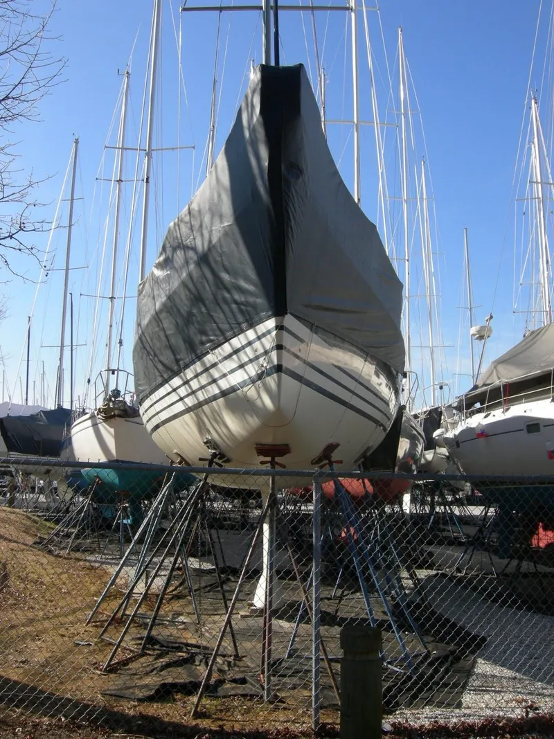 Slide: The Image of X-Yachts 2002 Model X-412 Mk III sailboat on stands, covered, in a boatyard. - 11