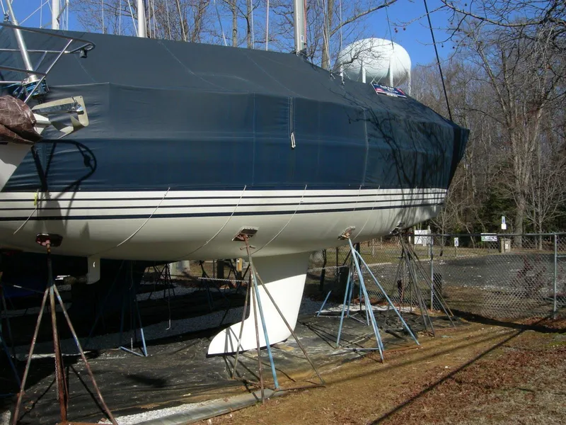Slide: The Image of 2001 X-Yachts X-412 Mk III sailboat on stands, outdoor storage. - 12
