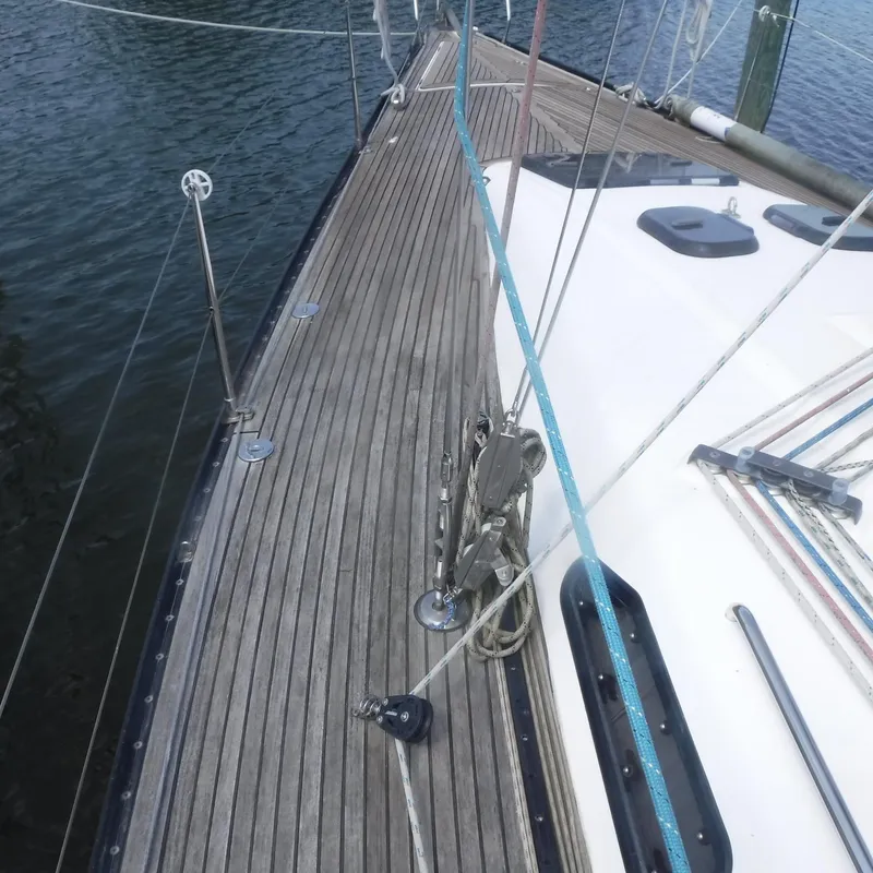 Slide: The Image of X-Yachts 2002 Model X-412 Mk III sailboat deck, featuring teak wood and rigging. - 17