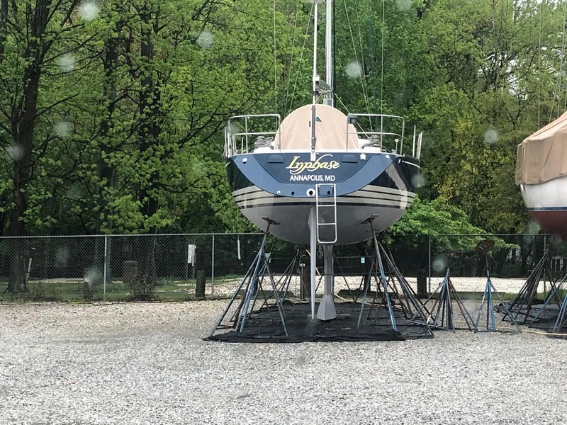Slide: The Image of X-Yachts 2002 Model X-412 Mk III sailboat on stands in a gravel yard. - 2