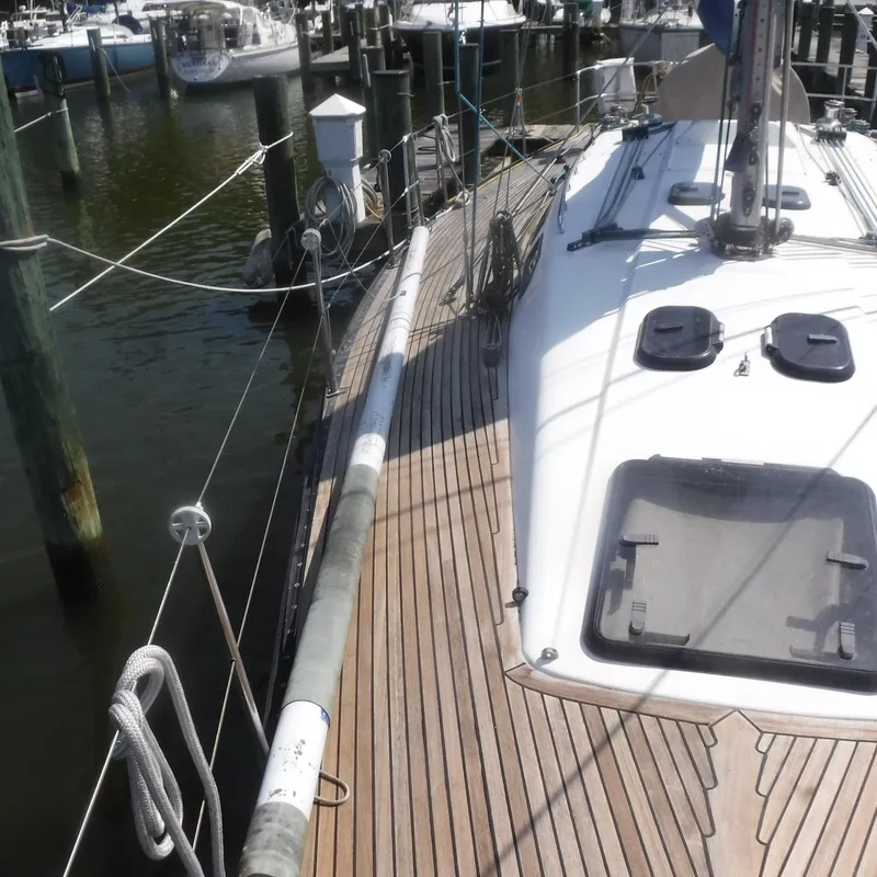 Slide: The Image of X-Yachts 2002 Model X-412 Mk III sailboat docked at marina, wooden deck visible. - 21