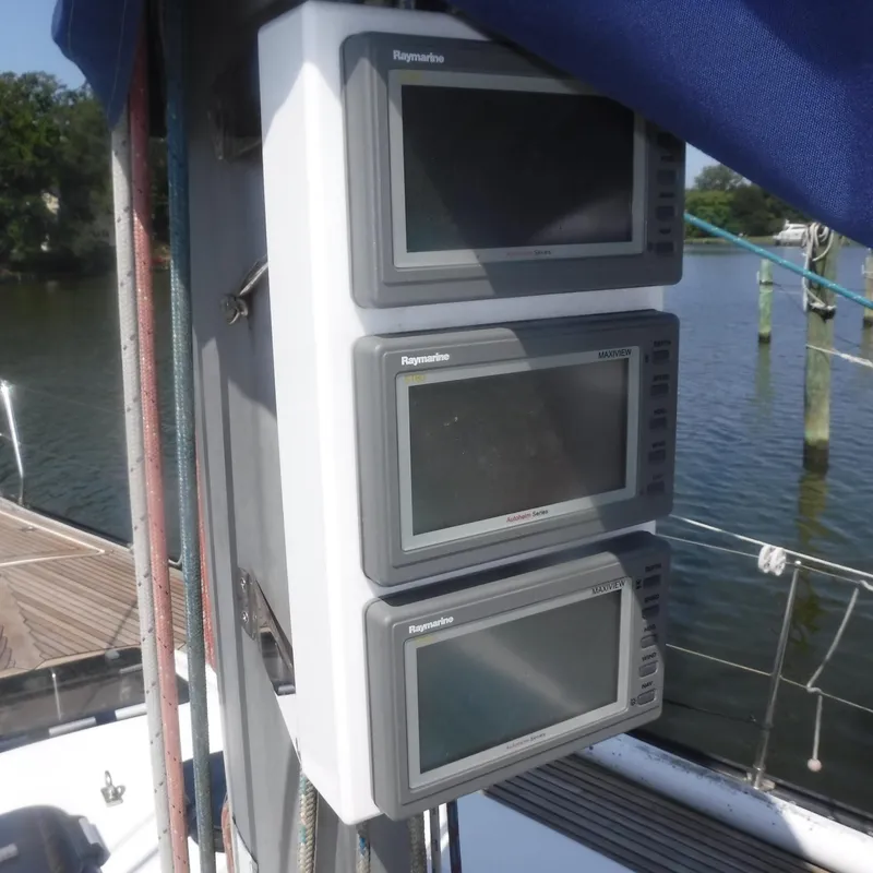 Slide: The Image of Three Raymarine navigation displays on a 2001 X-Yachts X-412 Mk III sailboat. - 23