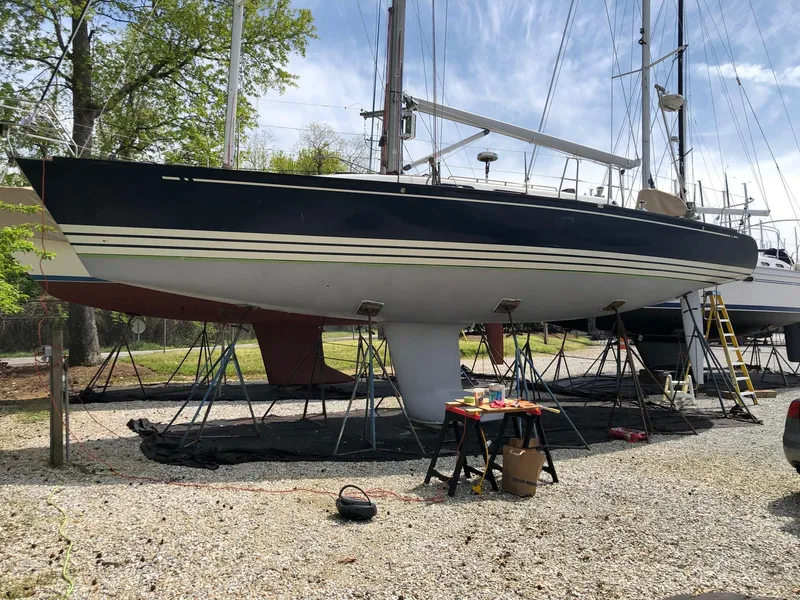 Slide: The Image of 2001 X-Yachts X-412 Mk III sailboat on stands, outdoor maintenance setting. - 3