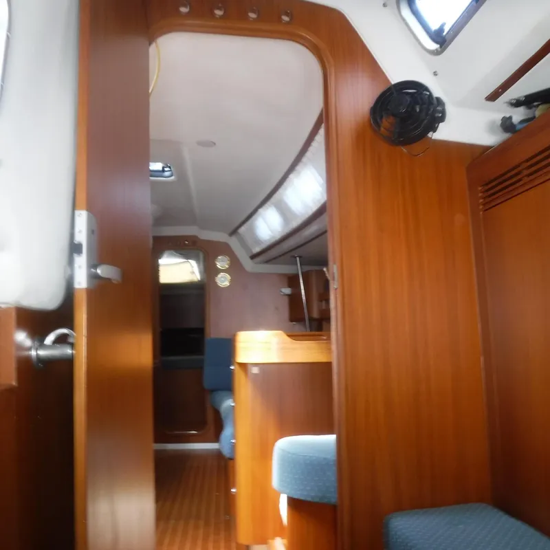 Slide: The Image of Interior of 2001 X-Yachts X-412 Mk III sailboat, featuring wood paneling and seating. - 35