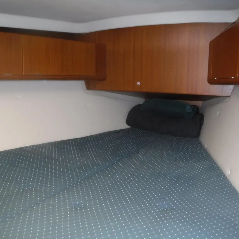 Slide: The Image of Cozy cabin interior of 2001 X-Yachts X-412 Mk III with wooden cabinets and polka dot bedding. - 38
