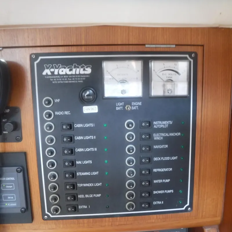 Slide: The Image of Control panel of 2002 X-Yachts X-412 Mk III, featuring various switches and gauges. - 47