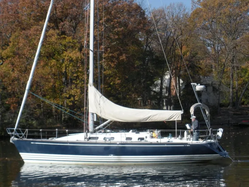 Slide: The Image of Sailing yacht X-Yachts 2002 Model X-412 Mk III on calm water, autumn trees in background. - 5