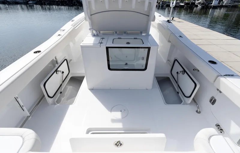 Slide: The Image of 2025 Sea Hunt Gamefish 30 boat interior with coffin box, spacious deck, and storage compartments. - 11