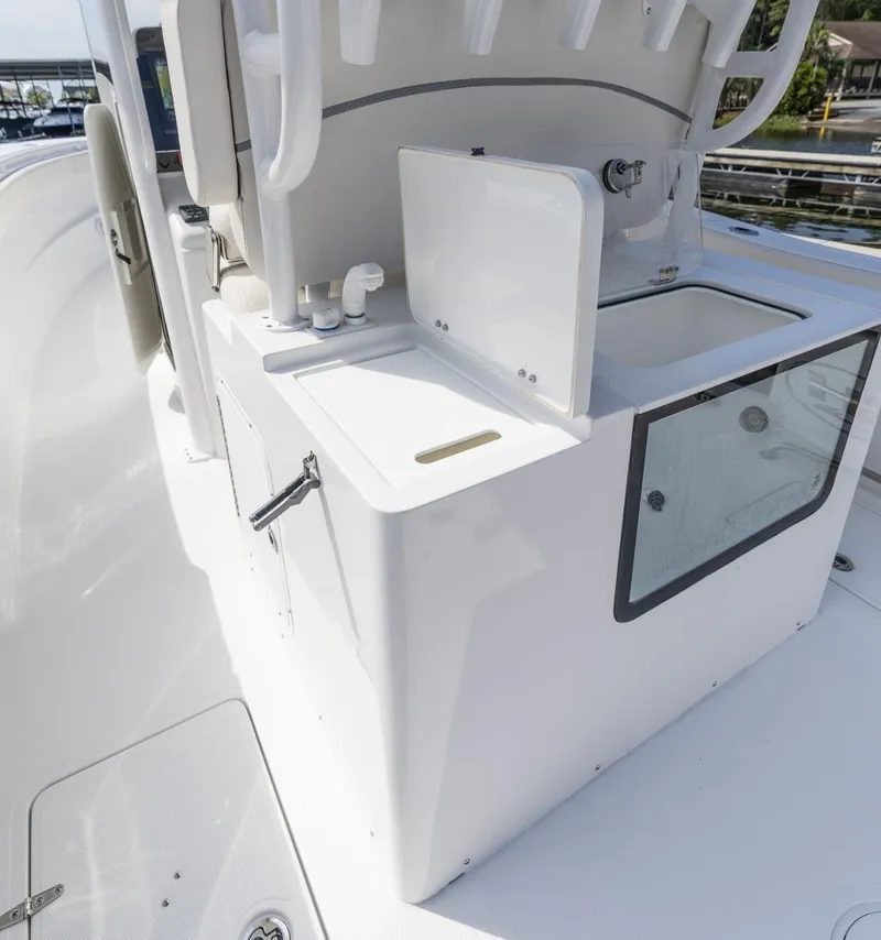 Slide: The Image of 2025 Sea Hunt Gamefish 30 boat interior with coffin box and sink. - 13