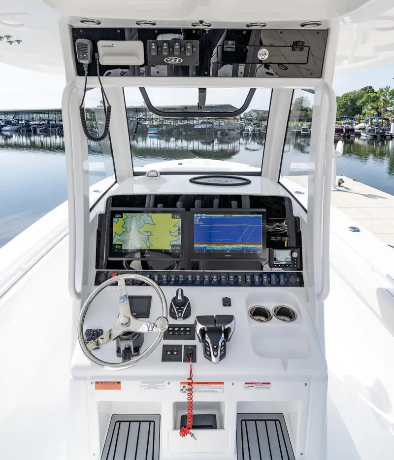 Slide: The Image of 2025 Sea Hunt Gamefish 30 helm with advanced navigation and control systems. - 14
