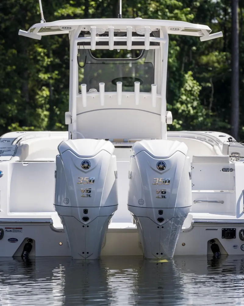 Slide: The Image of 2025 Sea Hunt Gamefish 30 boat with twin engines on water. - 16