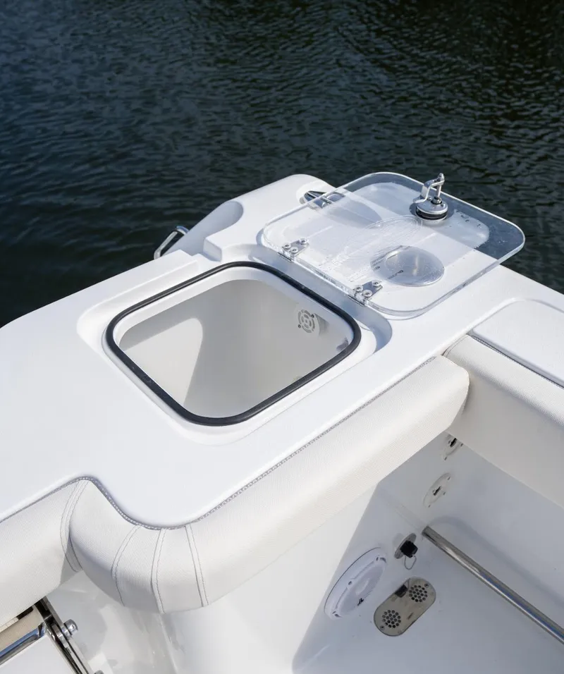 Slide: The Image of 2025 Sea Hunt Gamefish 30 with Coffin Box, featuring sleek white design and storage compartment. - 18