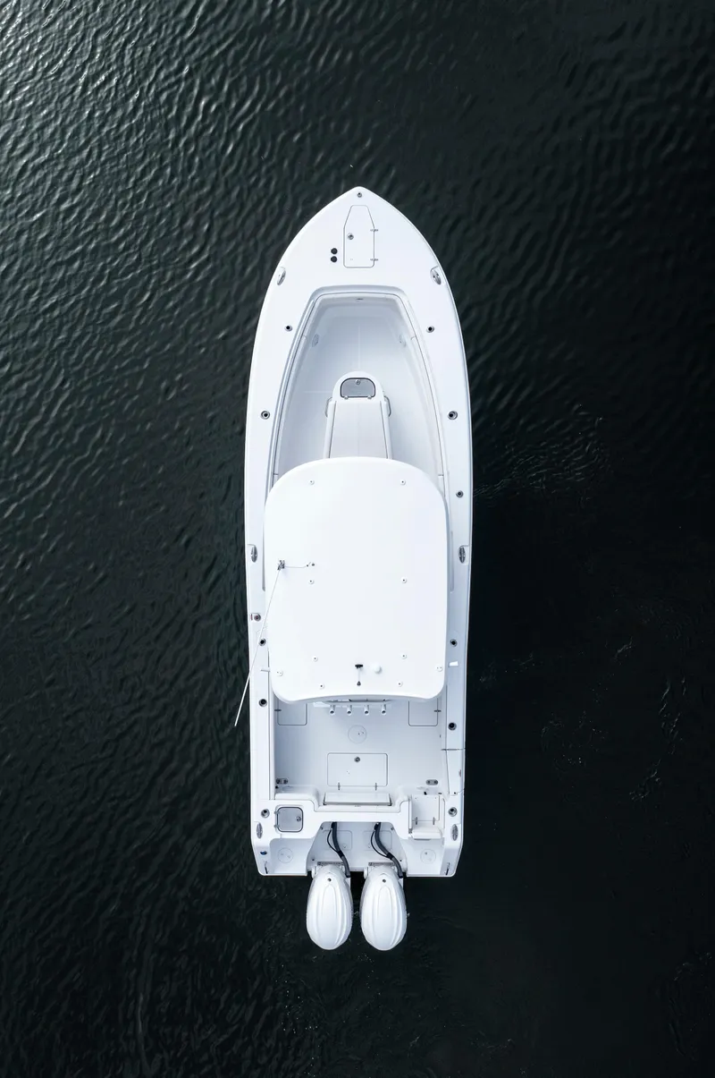 Slide: The Image of Aerial view of 2025 Sea Hunt Gamefish 30 boat with coffin box on dark water. - 25