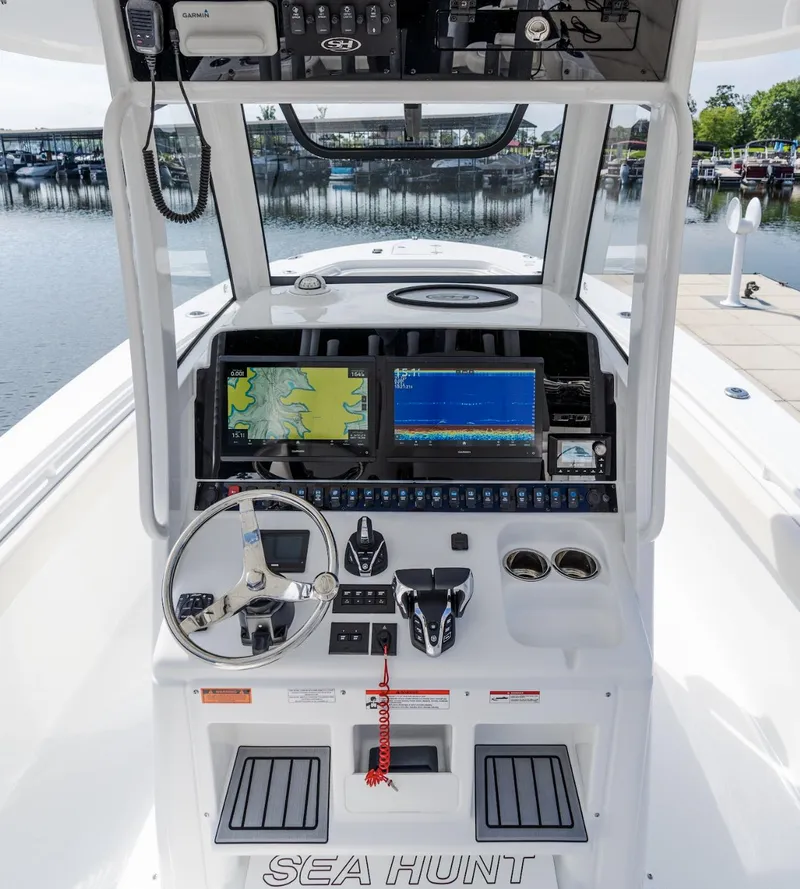 Slide: The Image of 2025 Sea Hunt Gamefish 30 helm with advanced navigation displays and controls. - 6