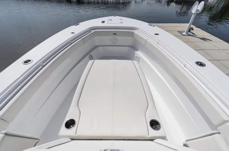 Slide: The Image of 2025 Sea Hunt Gamefish 30 boat with coffin box, docked by calm waters. - 7