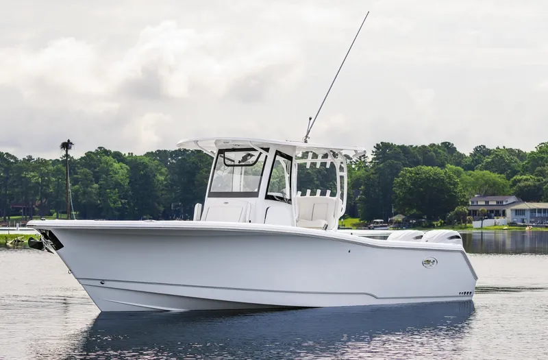 Slide: The Image of 2025 Sea Hunt Gamefish 30 boat with coffin box on calm water. - 8