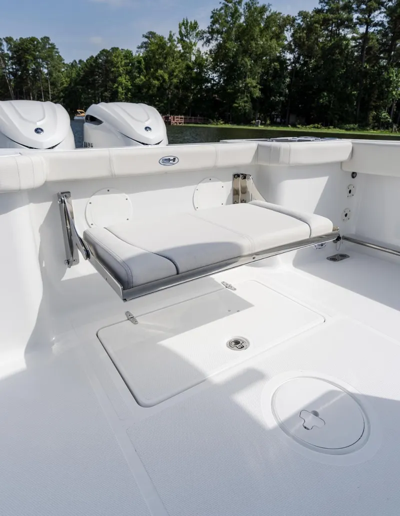 Slide: The Image of 2025 Sea Hunt Gamefish 30 boat interior with foldable seating and storage. - 9