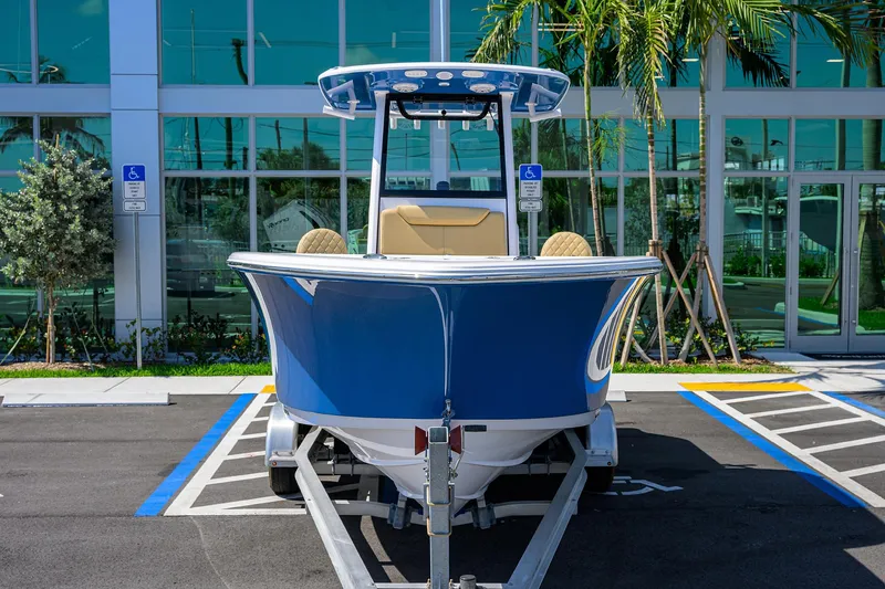 Slide: The Image of 2025 Sportsman Heritage 231 Center Console boat on trailer in parking lot. - 1