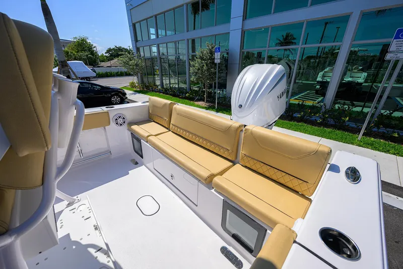 Slide: The Image of 2025 Sportsman Heritage 231 Center Console boat with tan seating and modern design. - 10