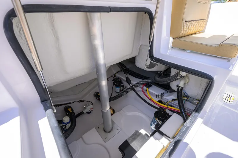Slide: The Image of 2025 Sportsman Heritage 231 Center Console interior wiring and components view. - 19