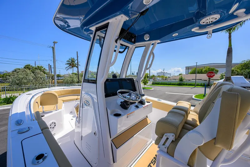 Slide: The Image of 2025 Sportsman Heritage 231 Center Console boat interior with modern helm and seating. - 24