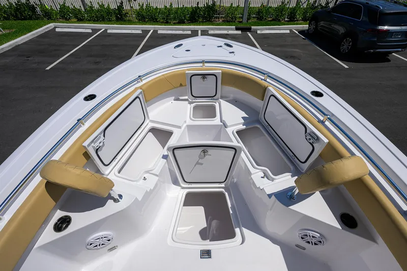 Slide: The Image of 2025 Sportsman Heritage 231 Center Console boat with open storage compartments. - 8