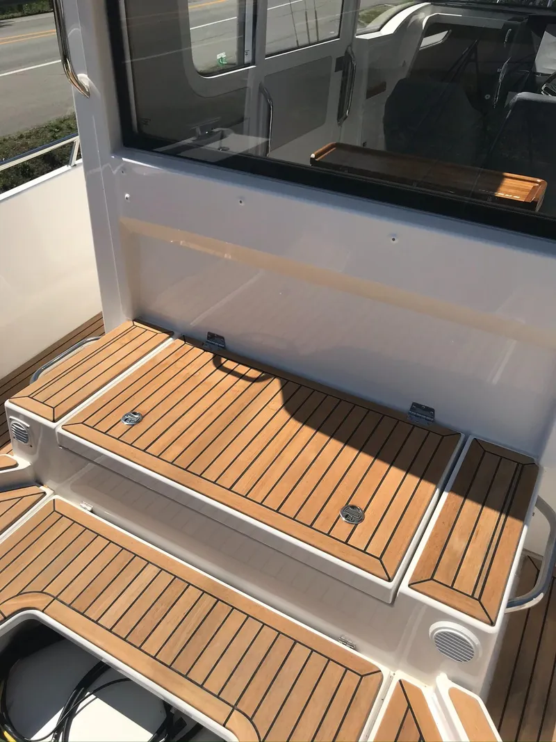 Slide: The Image of 2024 Nimbus C9 boat with teak deck steps and modern interior. - 18
