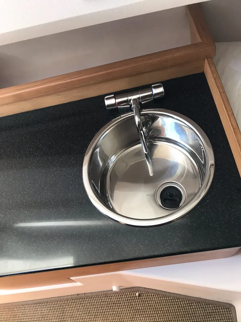 Slide: The Image of Stainless steel sink in 2024 Nimbus C9 boat interior. - 25