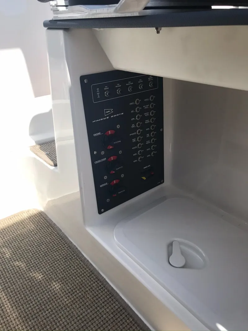 Slide: The Image of Control panel of 2024 Nimbus C9 boat, featuring switches and indicators. - 26