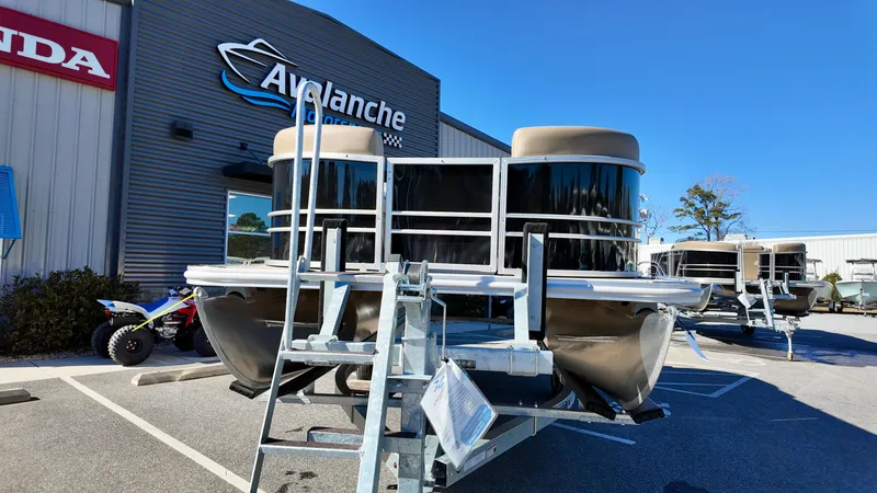 Slide: The Image of 2025 Sylvan Mirage 820 LZ pontoon boat displayed at dealership. - 3