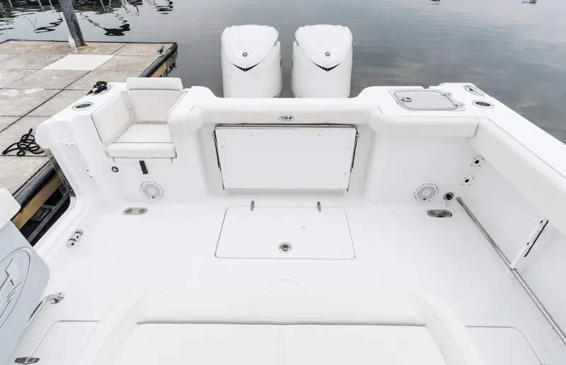 Slide: The Image of 2025 Sea Hunt Gamefish 30 boat with forward seating, dual engines, and spacious deck. - 14