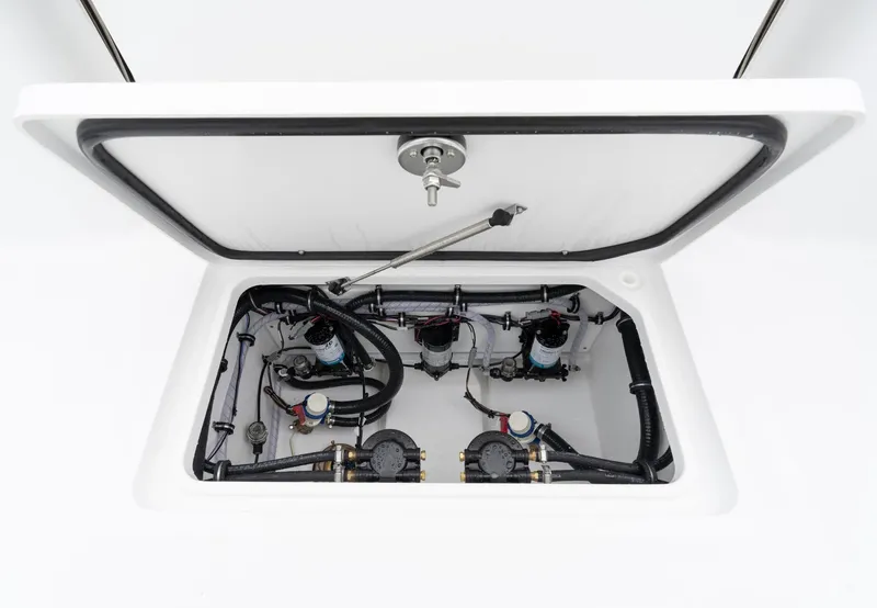 Slide: The Image of 2025 Sea Hunt Gamefish 30 Forward Seating boat compartment with mechanical components. - 16