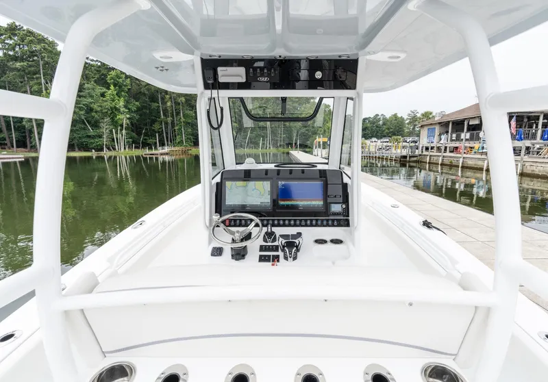 Slide: The Image of 2025 Sea Hunt Gamefish 30 boat cockpit with advanced navigation system. - 18