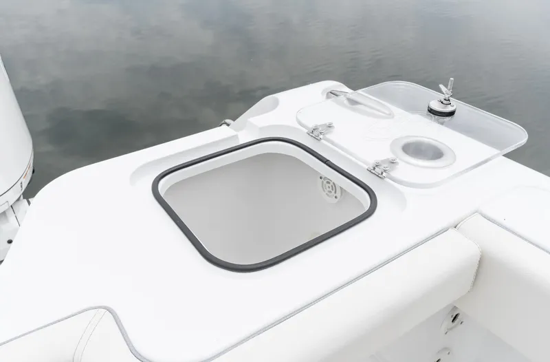 Slide: The Image of 2025 Sea Hunt Gamefish 30 boat with open storage compartment and seating. - 19