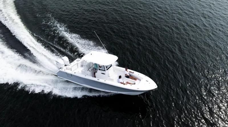 Slide: The Image of 2025 Sea Hunt Gamefish 30 cruising on open water, aerial view. - 2
