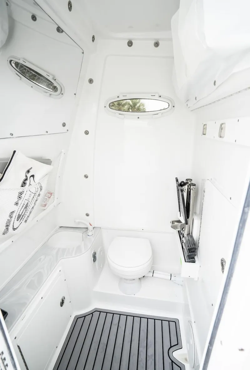 Slide: The Image of 2025 Sea Hunt Gamefish 30 boat bathroom with modern amenities and sleek design. - 20