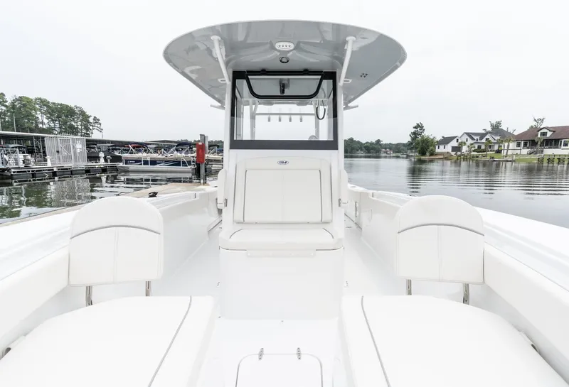 Slide: The Image of 2025 Sea Hunt Gamefish 30 Forward Seating boat on calm water. - 24