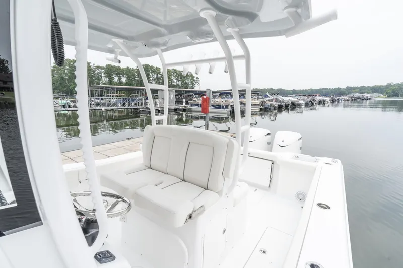 Slide: The Image of 2025 Sea Hunt Gamefish 30 boat with forward seating at a marina. - 25
