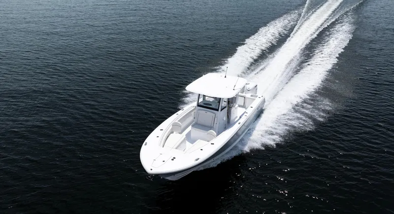 Slide: The Image of 2025 Sea Hunt Gamefish 30 boat cruising on open water. - 26