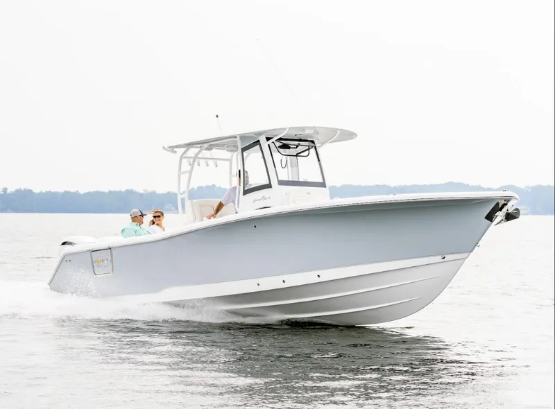 Slide: The Image of 2025 Sea Hunt Gamefish 30 Forward Seating boat cruising on water. - 27