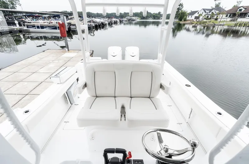 Slide: The Image of 2025 Sea Hunt Gamefish 30 boat with forward seating at a marina. - 33